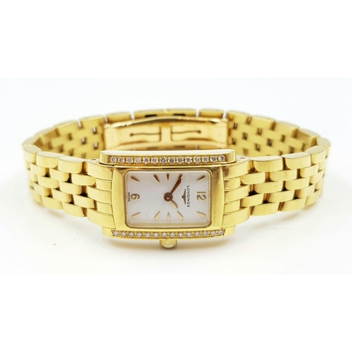 242 - LADIES 18K GOLD LONGINE WATCH WITH 18K GOLD STRAP AND DIAMOND BEZEL.  WITH BOX AND PAPERS  16 X 24mm... 