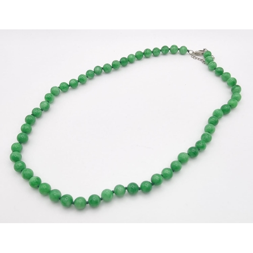 1156 - A Jade Bead Necklace. 8mm beads. 50cm.