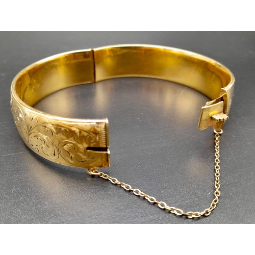 561 - 9K YELLOW GOLD WITH METAL CORE HINGED BANGLE       
9038