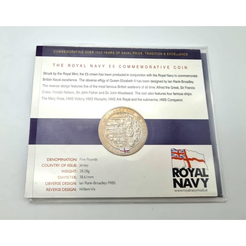 1075 - Four Commemorative Coins. To Include: The Royal Navy £5, Queen Victoria old head penny, We shall kee... 