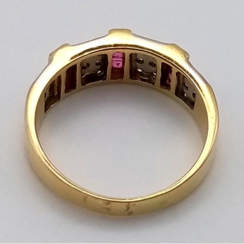 475 - an 18k yellow gold diamond and ruby ring.  5.1gms  size 0