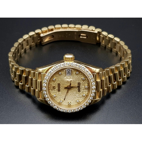 703 - A lovely, ladies, modern, 18 K yellow gold with diamonds ROLEX DATEJUST. 26 mm dial, automatic movem... 