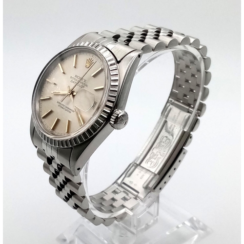 186 - A gents, stainless steel ROLEX DATEJUST watch. 36 mm dial, champagne face with gold hands and hour m... 