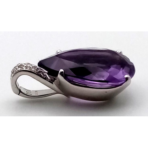 520 - A LARGE AMETHYST TEARDROP STONE SET IN 18K WHITE GOLD AND ENCRUSTED WITH BRIGHT DIAMONDS.  5.9gms  2... 