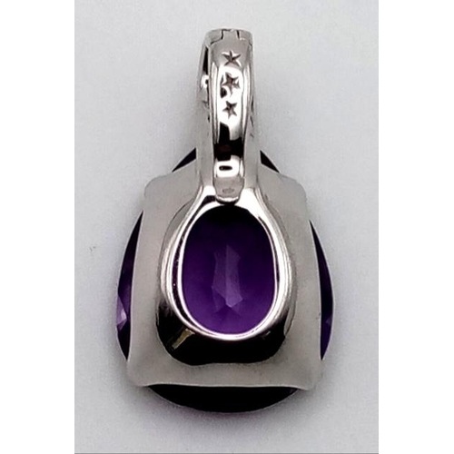 520 - A LARGE AMETHYST TEARDROP STONE SET IN 18K WHITE GOLD AND ENCRUSTED WITH BRIGHT DIAMONDS.  5.9gms  2... 