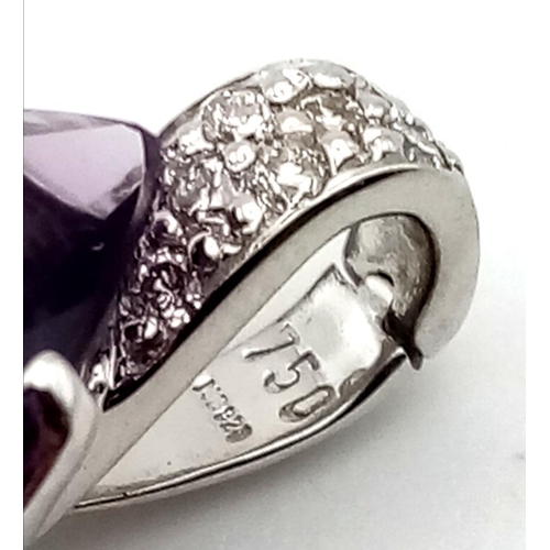 520 - A LARGE AMETHYST TEARDROP STONE SET IN 18K WHITE GOLD AND ENCRUSTED WITH BRIGHT DIAMONDS.  5.9gms  2... 