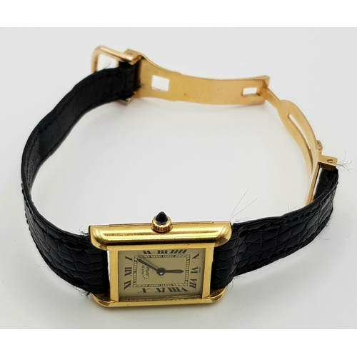 591 - A ladies, 18 K yellow gold electroplated CARTIER TANK watch. 20 mm dial, sapphire on winder, manual ... 