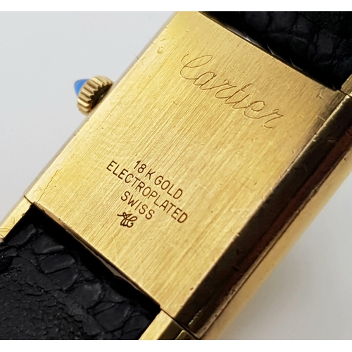 591 - A ladies, 18 K yellow gold electroplated CARTIER TANK watch. 20 mm dial, sapphire on winder, manual ... 