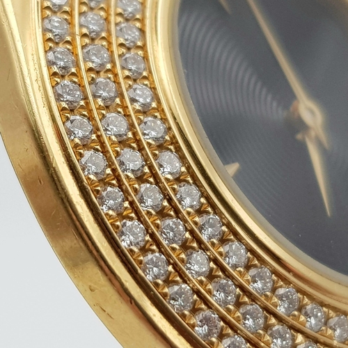 599 - A rare and collectable MAUBOUSSIN 18 K yellow gold watch with diamonds. Swiss made, 34 mm dial. blac... 