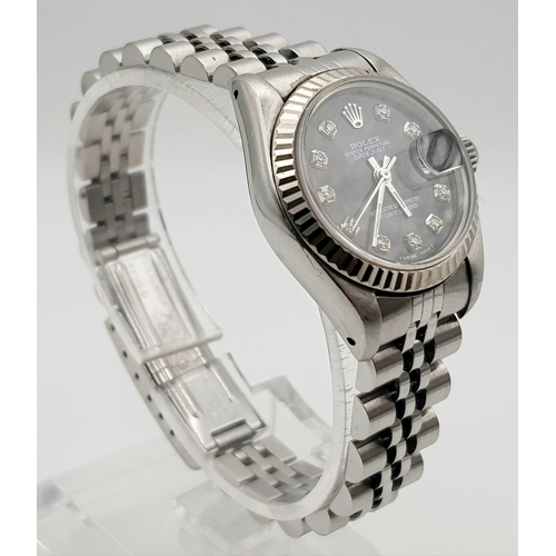 172 - A ladies, ROLEX DATEJUST watch. Stainless steel, 26 mm dial with diamonds on mother of pearl face.