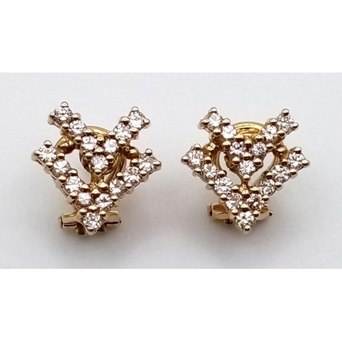 725 - A PAIR OD 18K GOLD AND DIAMOND EARRINGS IN A DOUBLE CHEVRON DESIGN. 6.5gms