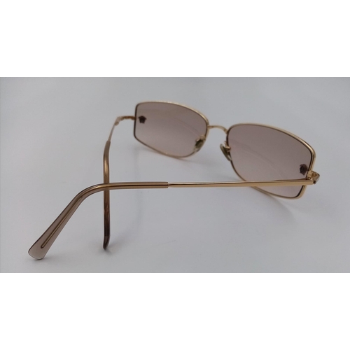 554 - A PAIR OF VERSACE SUNGLASSES    9074