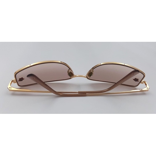 554 - A PAIR OF VERSACE SUNGLASSES    9074