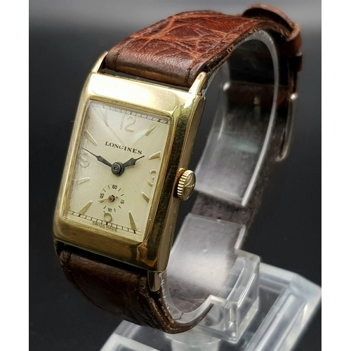 646 - A vintage, 14 K yellow gold, gents, LONGINES watch (Tank style). Dial 30 x 21 mm, leather strap. Wat... 