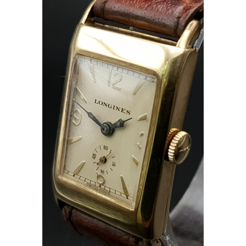 646 - A vintage, 14 K yellow gold, gents, LONGINES watch (Tank style). Dial 30 x 21 mm, leather strap. Wat... 