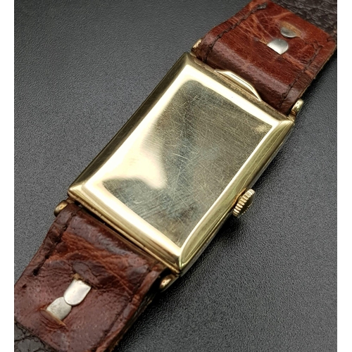 646 - A vintage, 14 K yellow gold, gents, LONGINES watch (Tank style). Dial 30 x 21 mm, leather strap. Wat... 