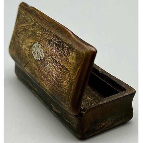 852 - A Victorian Wood and Silver Snuff or Trinket Box. Lid needs repair work so A/F. 8.5 x 5cm.