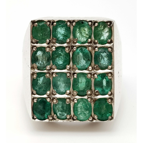 1012 - A SPECTACULAR EMERALD (7ct approx) RING SET IN SILVER.  27.4gms   size V