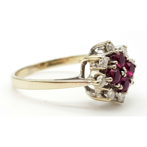 1018 - AN 18K WHITE GOLD RUBY AND DIAMOND CLUSTER RING.  4.15gms   size P