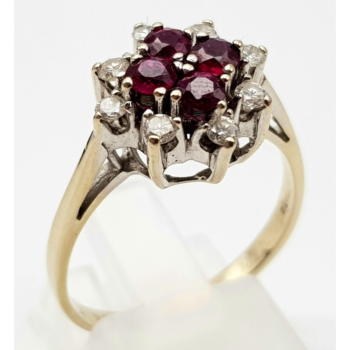 1018 - AN 18K WHITE GOLD RUBY AND DIAMOND CLUSTER RING.  4.15gms   size P