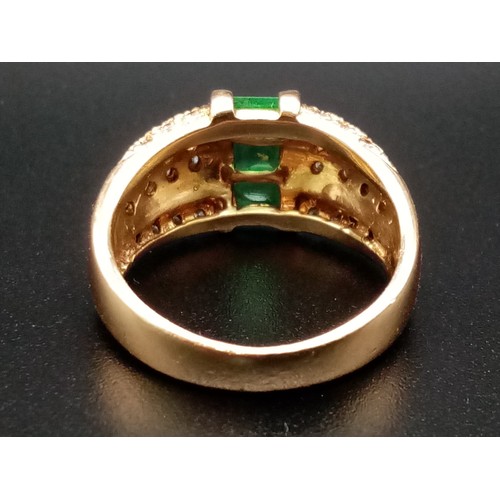 1137 - A FABULOUS 14K GOLD EMERALD AND DIAMOND RING. 9.62gms  size O