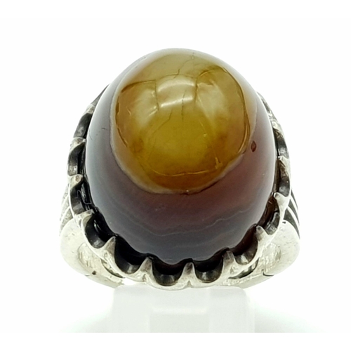 1151 - A LARGE AGATE DRESS RING SET IN SILVER. 22.4gms size W