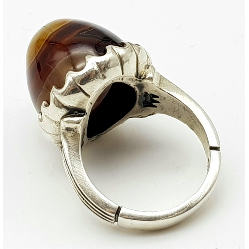 1151 - A LARGE AGATE DRESS RING SET IN SILVER. 22.4gms size W