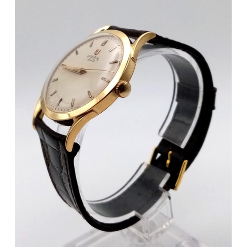 568 - A gents, UNIVERSAL watch. 33 mm dial, white face with gold hands and hour marks. Leather strap. In v... 