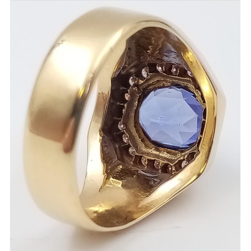 570 - An 18K Yellow Gold Diamond and Tanzanite Ring. Beautiful central blue tanzanite - 2ct, surrounded by... 