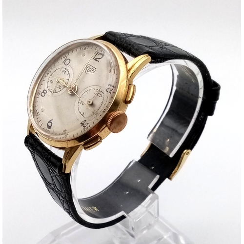 575 - An 18 K yellow gold HEUER gents watch with chronometer. 33 mm dial, leather strap, in excellent work... 