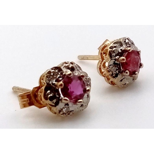 656 - A PAIR OF 9K GOLD DIAMOND AND RUBY STUD EARRINGS1.08gms