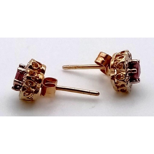 656 - A PAIR OF 9K GOLD DIAMOND AND RUBY STUD EARRINGS1.08gms