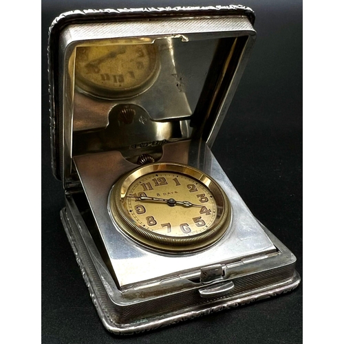 928 - An Antique Solid Silver Engine Turned Travelling Clock. Hallmarks for Birmingham 1929. 6.5 x 7.5cm. ... 