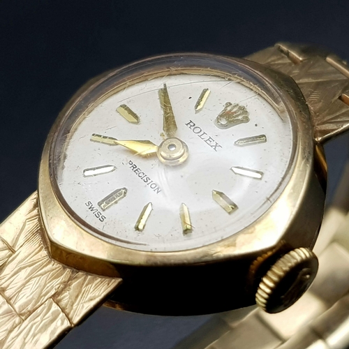 613 - A vintage, ladies, 9 K yellow gold ROLEX PRECISION watch. 17 mm dial, white face with gold hands and... 