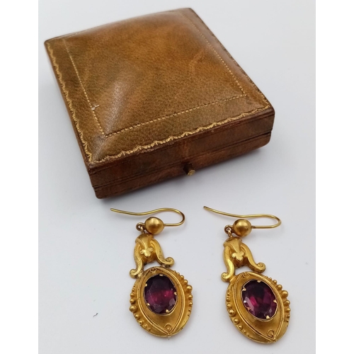 578 - A Pair of Victorian 18K Yellow Gold and Ruby Drop Earrings. Beautifully designed with a large 2ct ov... 