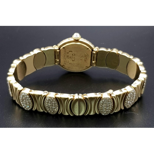 717 - Ladies CARTIER watch oozing elegance and sophistication. 18 K yellow gold, loaded with numerous bril... 