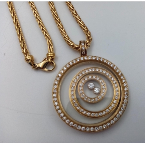 359 - An 18K Yellow Gold Psychedelic Floating Diamond Pendant on an 18K Yellow Gold Chain. 32.74g total we... 