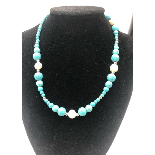 1163 - A Cultured Freshwater Pearl and Graduated Turquoise Howlite Necklace. 38cm.