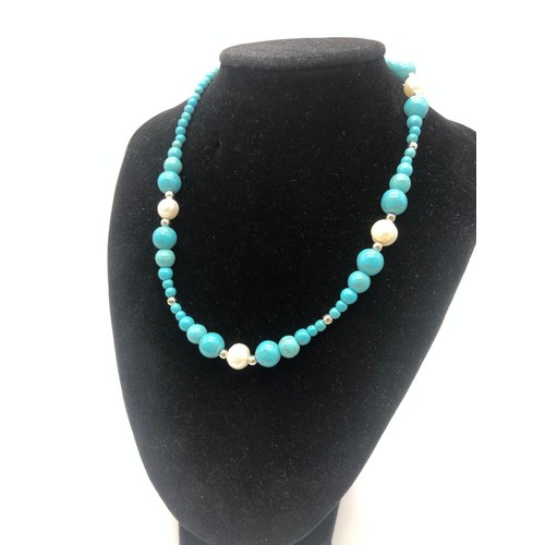 1163 - A Cultured Freshwater Pearl and Graduated Turquoise Howlite Necklace. 38cm.