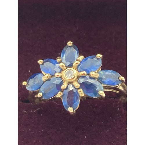 28 - Beautiful 9 carat GOLD, SAPPHIRE and DIAMOND RING, having diamond point to centre with an eight sapp... 