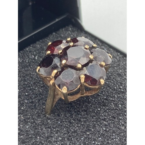 140 - 9 carat GOLD,GARNET CLUSTER RING , having seven large Garnets set to top.Full UK hallmark. Complete ... 