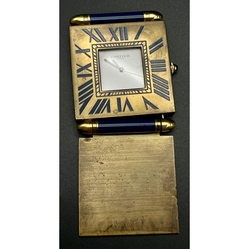 1039 - Cartier travelling alarm clock in working condition