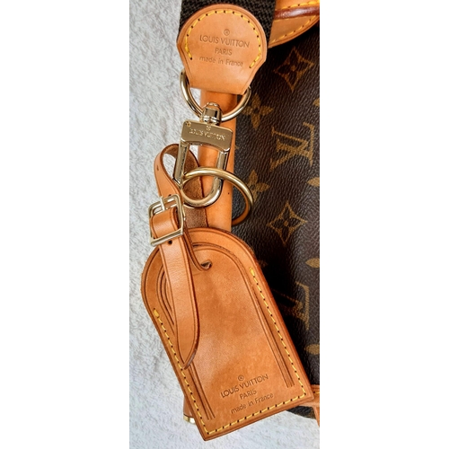 234 - A Louis Vuitton Monogram Canvas Luggage Satchel. This extra large bag has two carrying methods - han... 