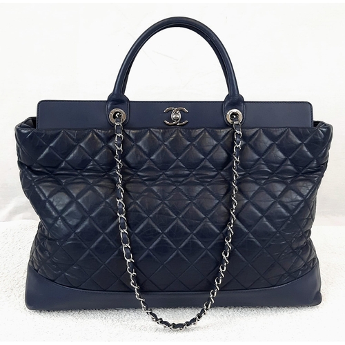 96 - A Blue Chanel Grand XL Shopping Tote Bag. Quilted Caviar leather diamond design. Interwoven leather ... 