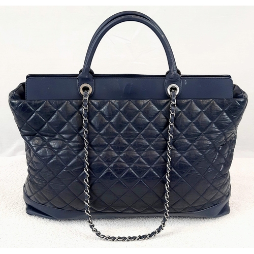 96 - A Blue Chanel Grand XL Shopping Tote Bag. Quilted Caviar leather diamond design. Interwoven leather ... 