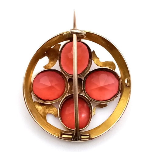 991 - An Early Yellow Metal Red Gemstone Circular Brooch. 3.5cm diameter. 8.2g total weight.