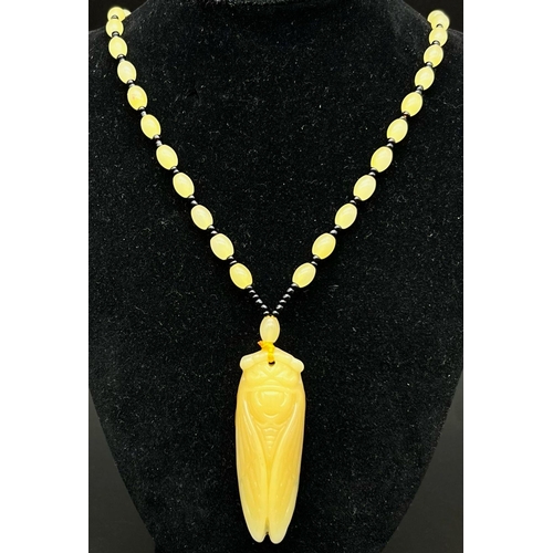 1031 - Chinese Jade carved lucky beads necklace with a a Grasshopper pendant. 39.5cm in length