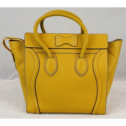 271 - A Celine of Paris Large Yellow Phantom Handbag. Bright vibrant yellow leather. External zipped pocke... 