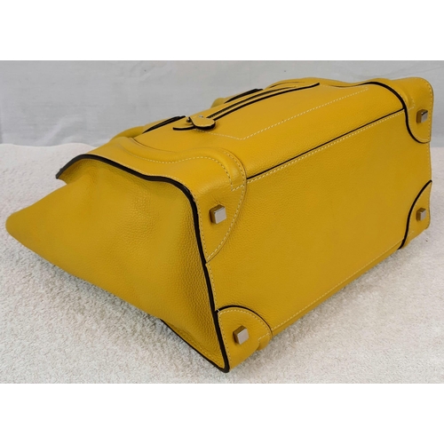 271 - A Celine of Paris Large Yellow Phantom Handbag. Bright vibrant yellow leather. External zipped pocke... 