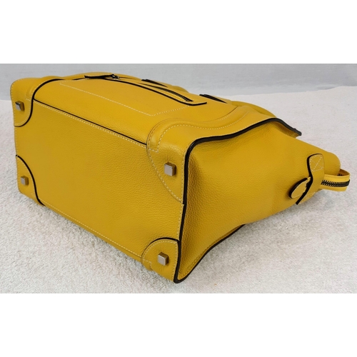 271 - A Celine of Paris Large Yellow Phantom Handbag. Bright vibrant yellow leather. External zipped pocke... 